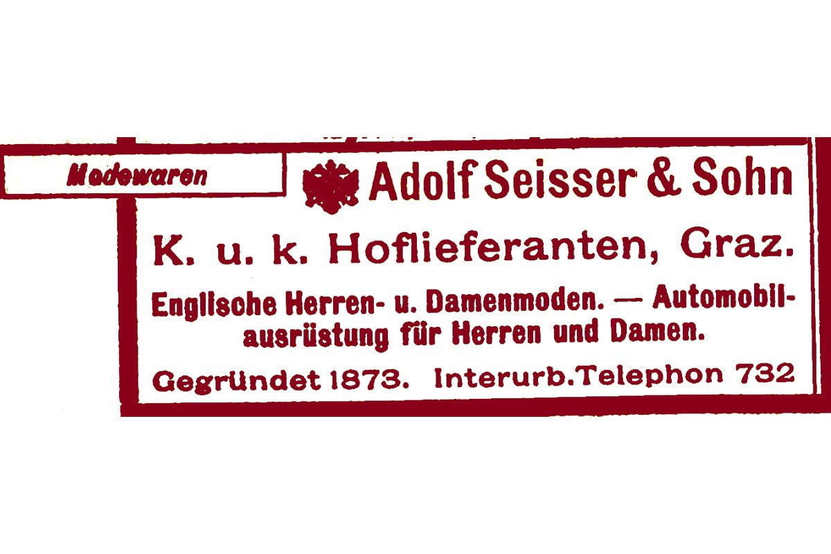 Eine alte deutsche Visitenkarte der Firma "Adolf Seisser & Sohn" in Graz, die für Herren- und Damenmode und Automobilzubehör wirbt; gegründet 1873 mit der Telefonnummer 732.