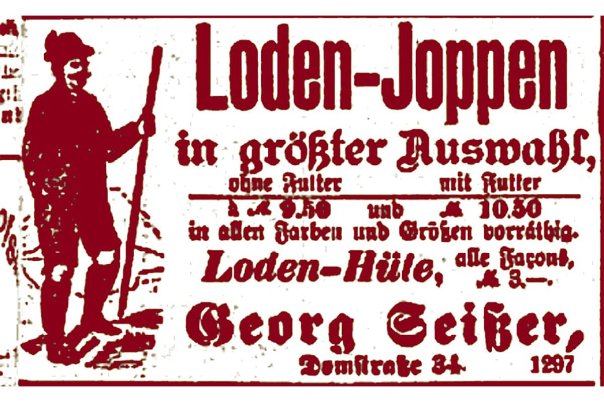 Eine alte deutsche Werbung zeigt einen Mann in traditioneller Kleidung mit einem Hut und einem Stock auf der linken Seite. Der Text wirbt für "Loden-Joppen" und "Loden-Hüte" in verschiedenen Ausführungen, mit Preisen und dem Namen "Georg Seifert, Domstraße 34".